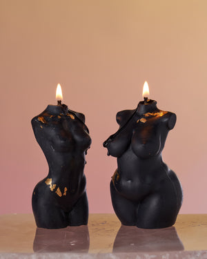 Black Queen of Creation Venus Priestess and Empress candle, elegantly burning with a mesmerizing flame. This candle, handcrafted with precision, showcases the powerful blend of divine feminine energy. The captivating scene embodies softness, pleasure, and confidence illuminated by the intuitive wisdom of the candles. A stunning addition to your sacred space and rituals.