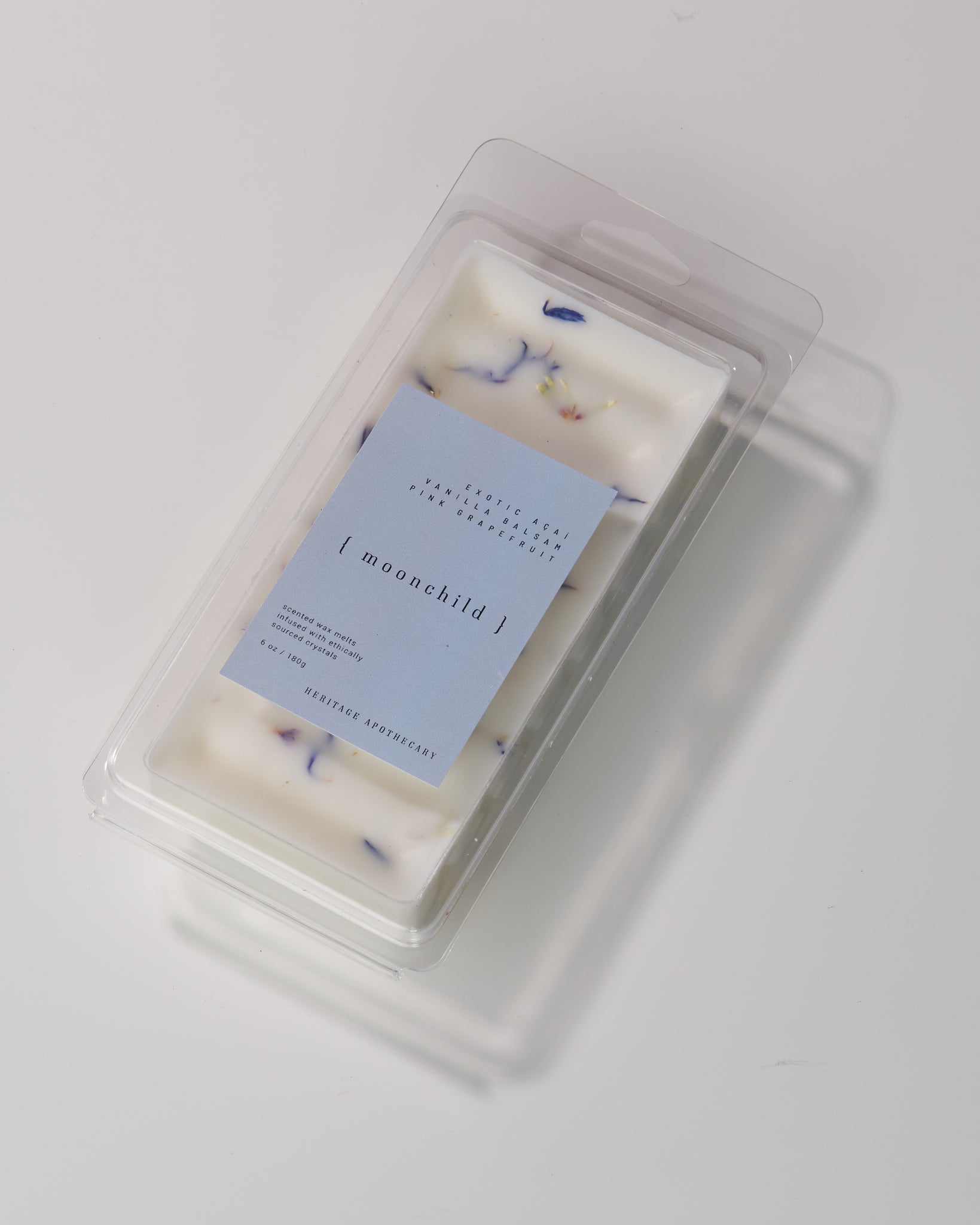 Coconut and soy wax melts with Moonchild fragrance - featuring grapefruit, acai berry, peach, jasmine, musk, and vanilla balsam notes. Enhanced with natural cornflowers for a mystical touch and third eye healing. Elevate your home's aroma.