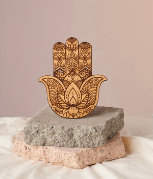 Intricately Etched Wooden Hamsa Hand - Crystal Grid, Altar Decor, and Meditation Adornment. Offers Energetic Protection and Magnetizes Goodness + Abundance. 5.5”x 5” Wooden Amulet.