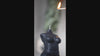 Black Queen of Creation Venus Priestess candle being lit and burning beautifully. Experience the powerful blend of divine feminine energy in action.