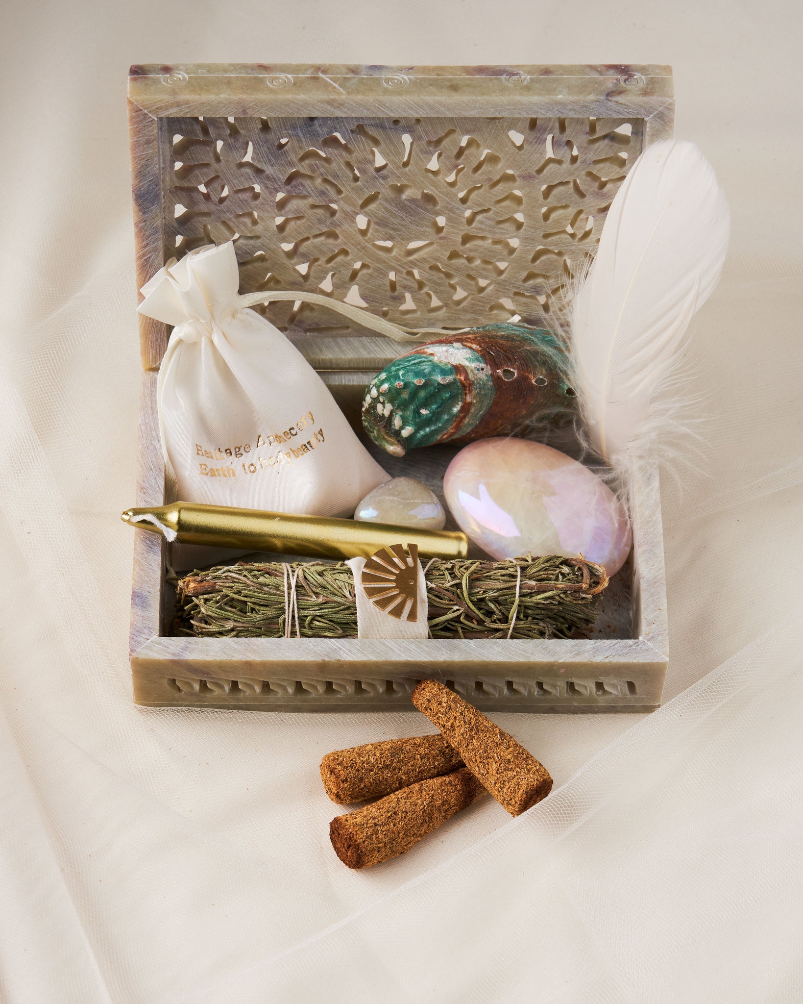 Discover Spiritual Alignment and Manifestation - The Surrender Kit by Heritage Apothecary + Victory Jones. Rosemary Wand, Palo Santo Cones, Crystals, and Guided Meditation in a Beautiful Hand Carved Box!