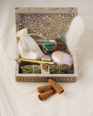 Discover Spiritual Alignment and Manifestation - The Surrender Kit by Heritage Apothecary + Victory Jones. Rosemary Wand, Palo Santo Cones, Crystals, and Guided Meditation in a Beautiful Hand Carved Box!