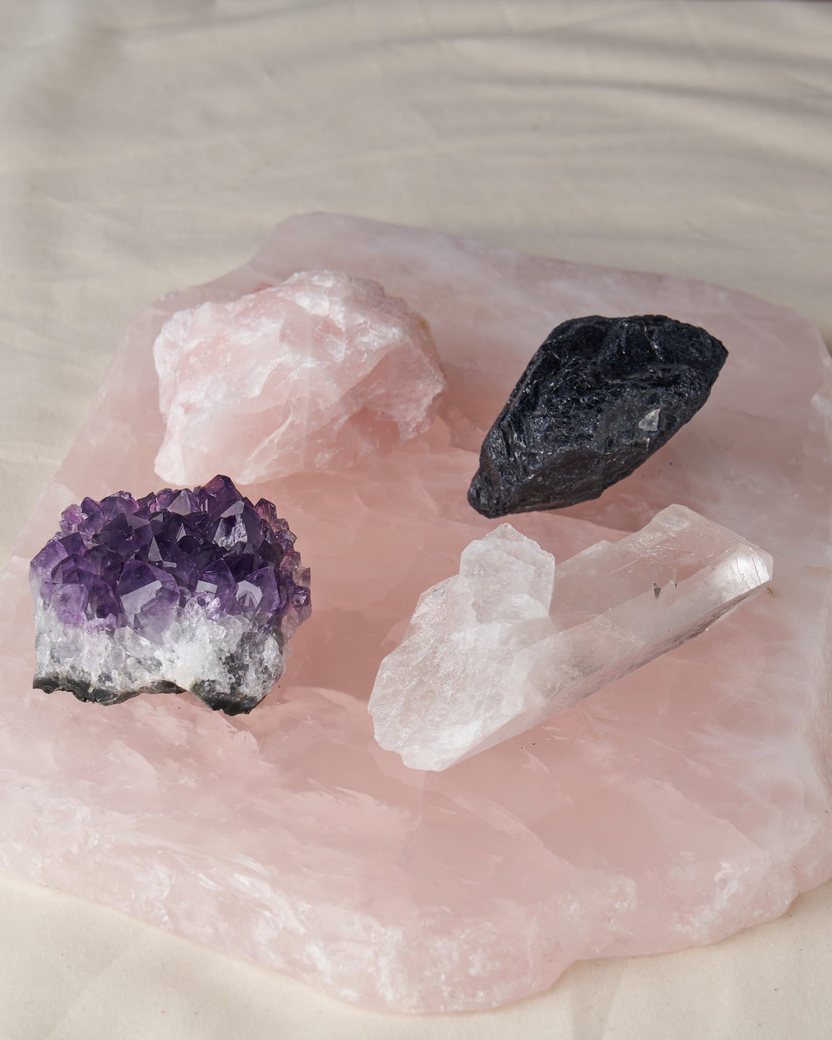 Experience the Power of Healing and Protection with Amethyst, Black Tourmaline, Rose Quartz, and Clear Quartz | Crystal Set | Energy Healing | Spiritual Development | Grounding Stone | Universal Love | Cleansing and Charging | 3”x2” Palm-Sized Stones