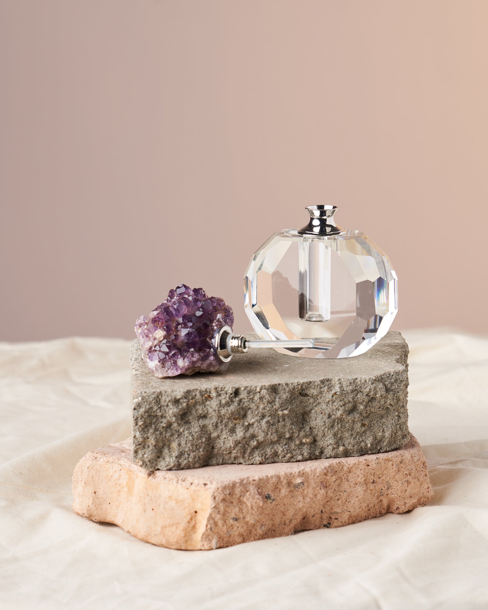 Amethyst Crystal Perfume Bottles - Rose Quartz-Embellished Collection: Elevate your aromatherapy with these amethyst cluster bottles. Available in Mama, Baby, and Zaddy sizes. Ideal for holding perfumes and essential oils. Harness the power of intuition, spiritual growth, and protection. Compact, elegant designs with varying oil capacities. Great for gifting.