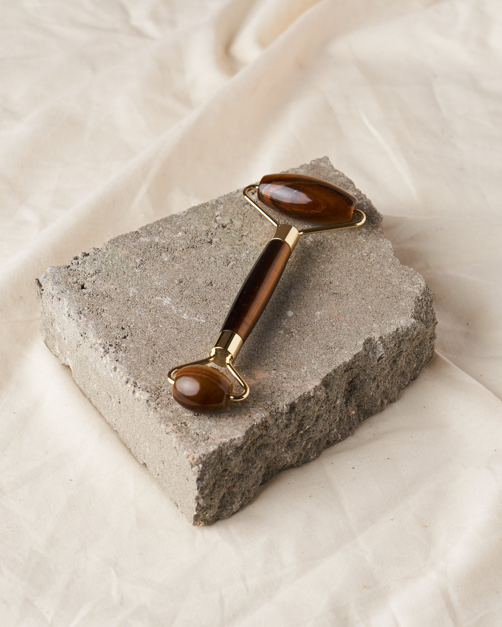 Tiger's Eye Precious Stone Facial Massager: Elevate your skincare ritual with our Tiger's Eye facial massager. Experience improved circulation, toned skin, and a rejuvenating effect. Choose Tiger's Eye for a unique crystal experience