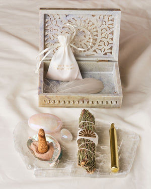 Embrace true surrender with the Surrender Kit - Rosemary Wand, Palo Santo Cones, Abalone Shell, and More in a Hand Carved Soapstone Box. Release Energetic Imbalance and Step into Your Highest Potential!
