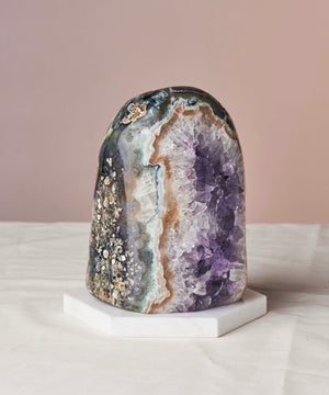 Amethyst lamps promote tranquility, clarity, and spirituality. Perfect decor for home or office, and great gifts. Emit healing vibes with a soft glow. Includes polished amethyst lamp and electric tealight bulb. Sizes: Medium (4-6”), Large (7-10”), XL (8-14”). Natural size variations.