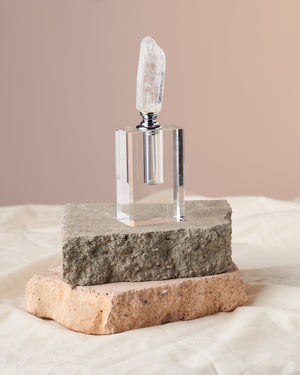 Master Quartz Bottle - Luxurious Clear Quartz-Encrusted Perfume and Essential Oil Container, 6 inches tall and 4 inches in diameter. Ideal for aromatherapy. 'Master stone' clear quartz amplifies energy. A perfect gift option. Compact design with 1 dram (5ml) oil capacity.